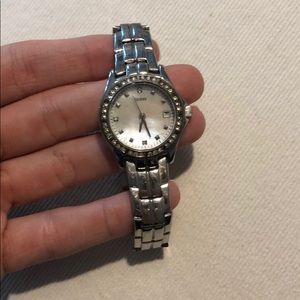 Guess watch with diamond lining around face